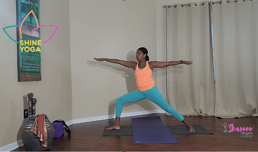 Shannon Thigpen of SHINE Yoga displaying warrior 2 pose in virtual class